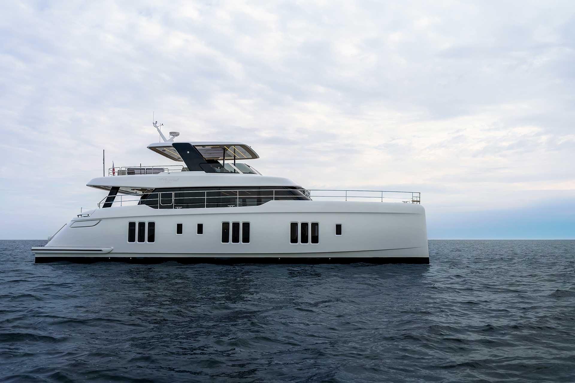 2026 Sunreef 70 Sunreef Power catamaran exterior profile starboard side view showcasing dual hulls and flybridge tower in ...