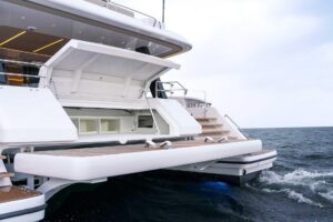 Sunreef 70 Sunreef Power catamaran bow seating area with forward lounge and cushioned sunpad.