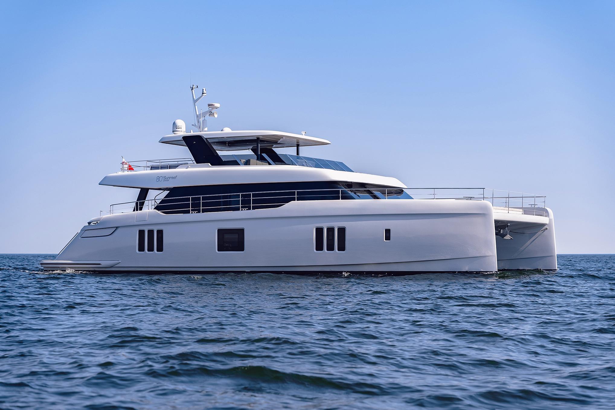 2026 Sunreef 80 Sunreef Power catamaran with twin hulls and modern profile anchored in Fort Lauderdale waters.