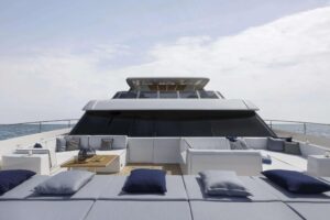Sunreef 80 Power catamaran bow section with dual hulls and forward seating area.