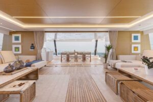 Sunreef 80 Power catamaran salon with comfortable seating, large windows, and modern interior finishes.