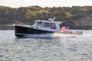 Bow view of 2026 True North 39 Outboard Express with forward seating and windshield, anchored in South Dartmouth, Massachu...