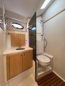 2026 True North 39 Outboard Express 44-foot center console helm station with dual Garmin displays, stainless steel wheel, ...
