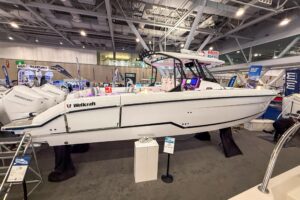 2026 Wellcraft 38 T-Top center console with hardtop and tower in profile at South Dartmouth, MA.